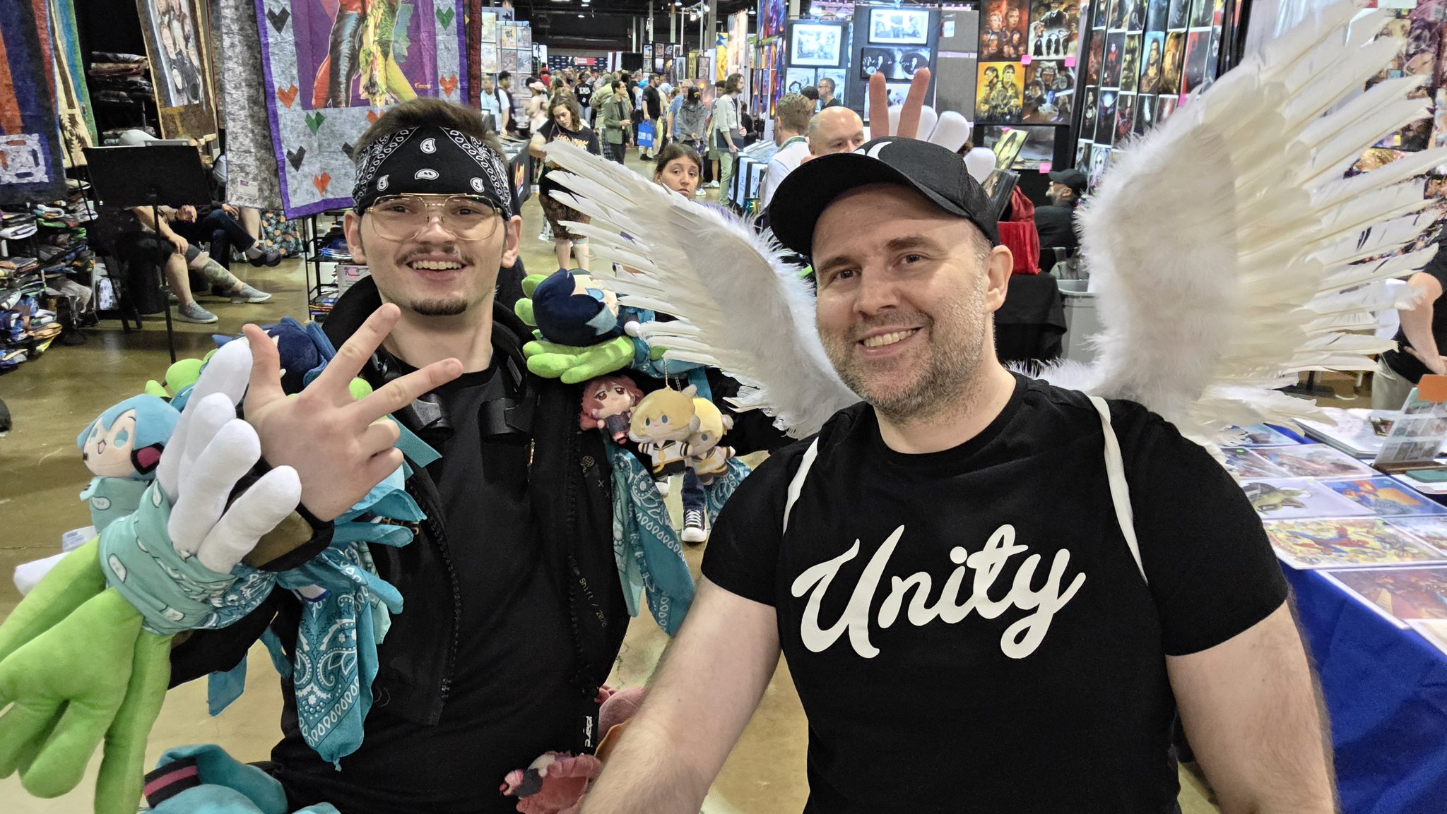 Adam taking a selfie with an attendee wearing glasses at Fan Expo