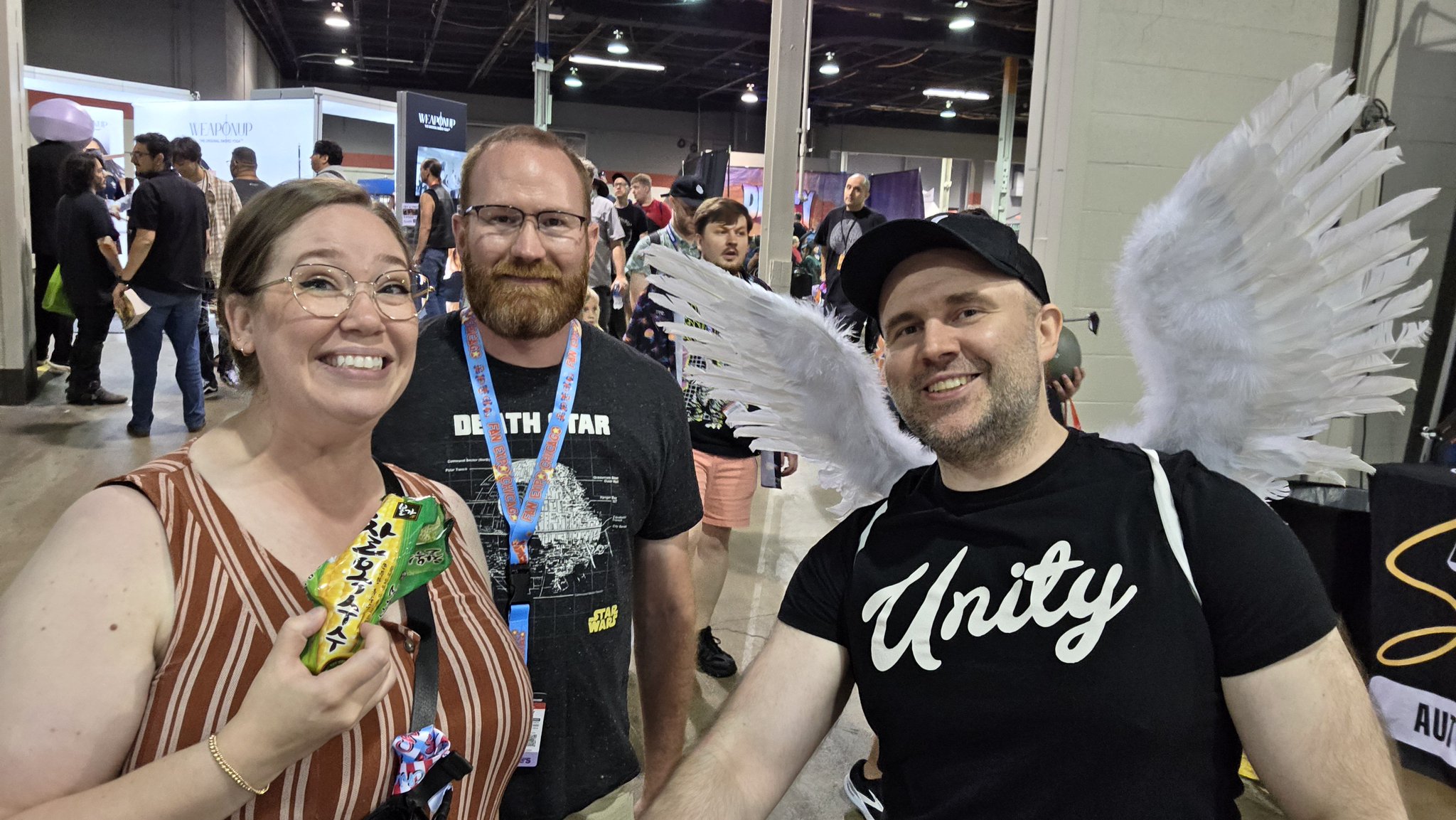 Adam taking a selfie with an attendee in a navy shirt at Fan Expo