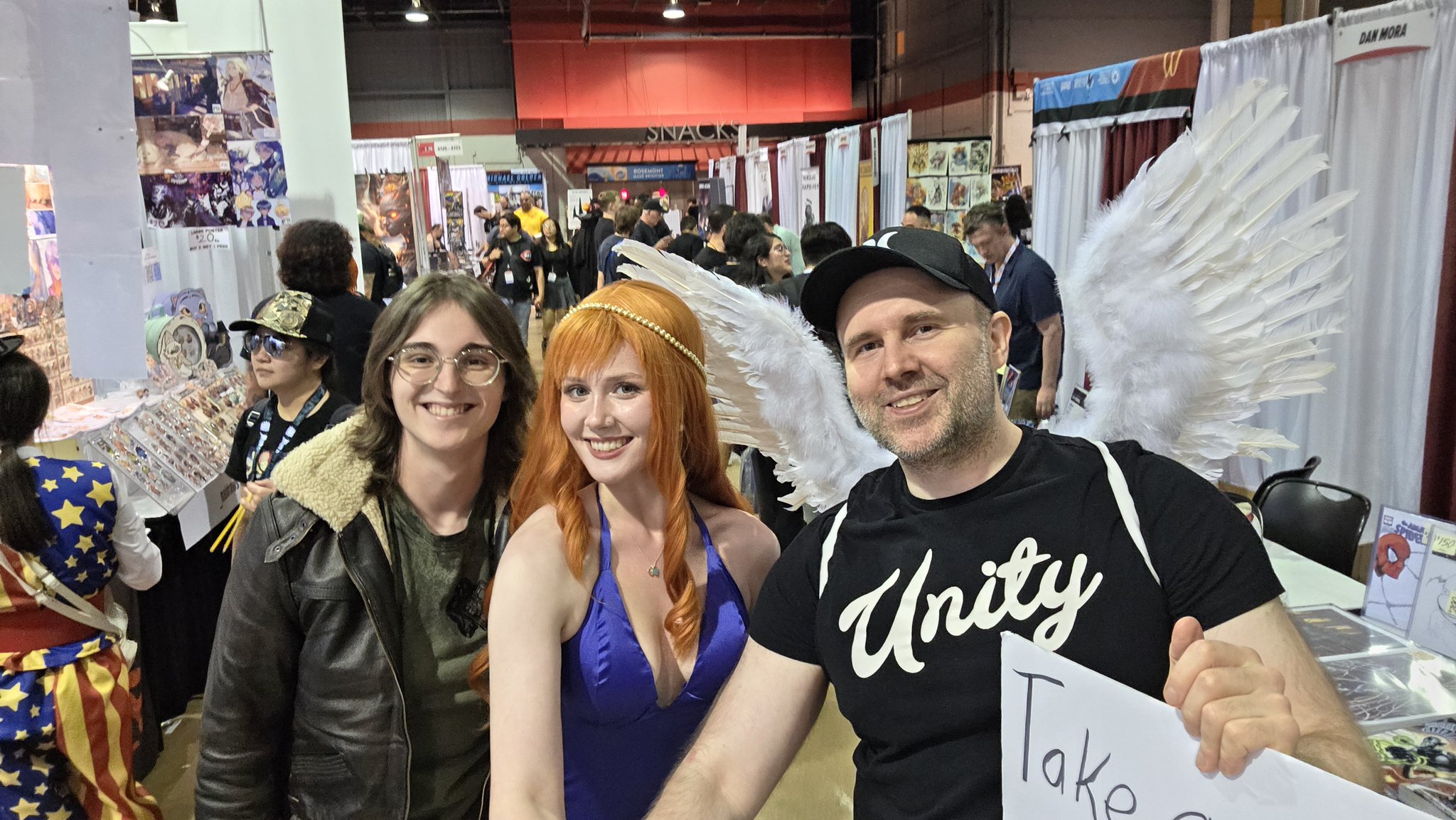 Adam taking a selfie with an attendee in a denim jacket at Fan Expo