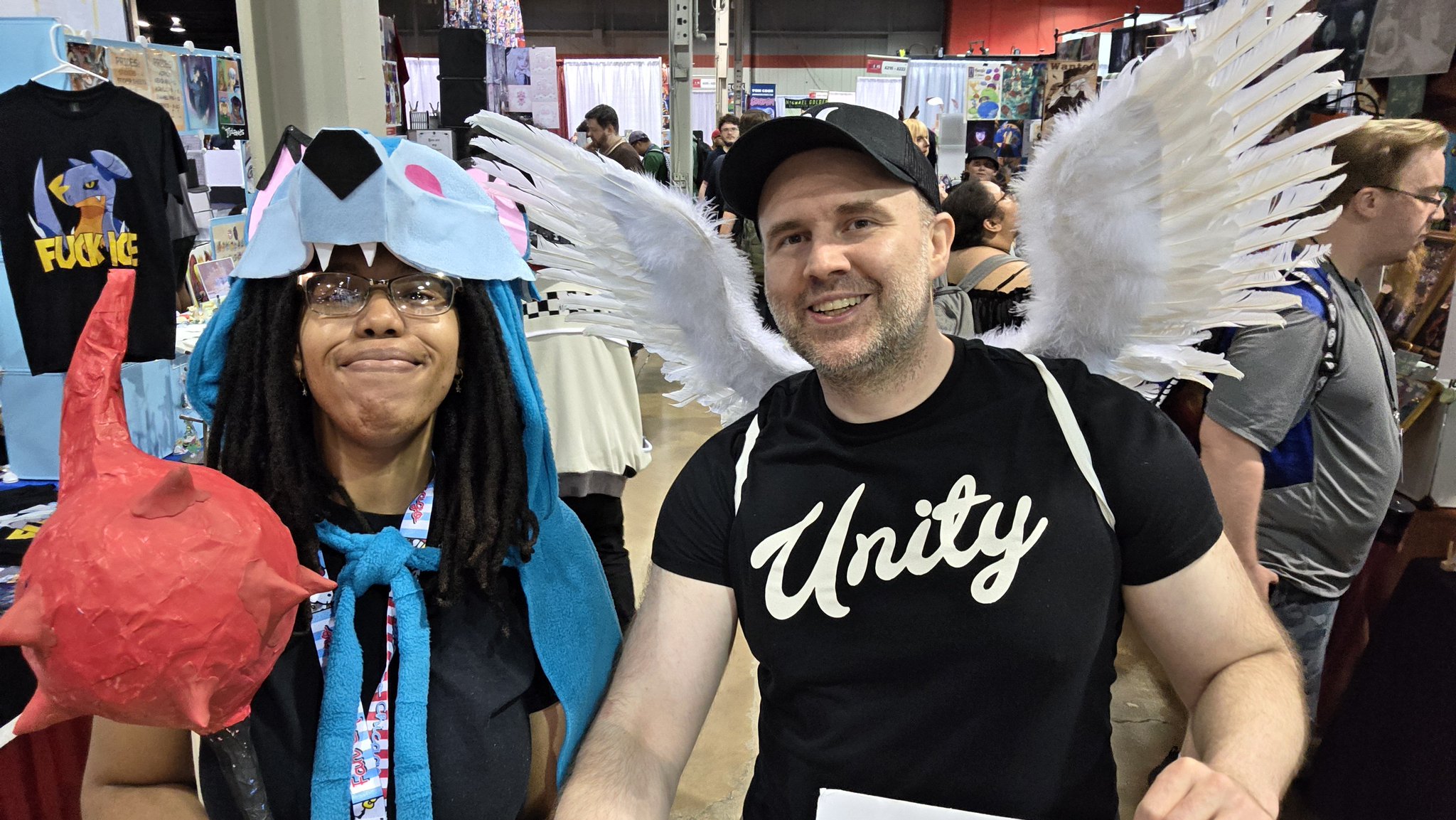 Adam taking a selfie with an attendee in a gray hoodie at Fan Expo