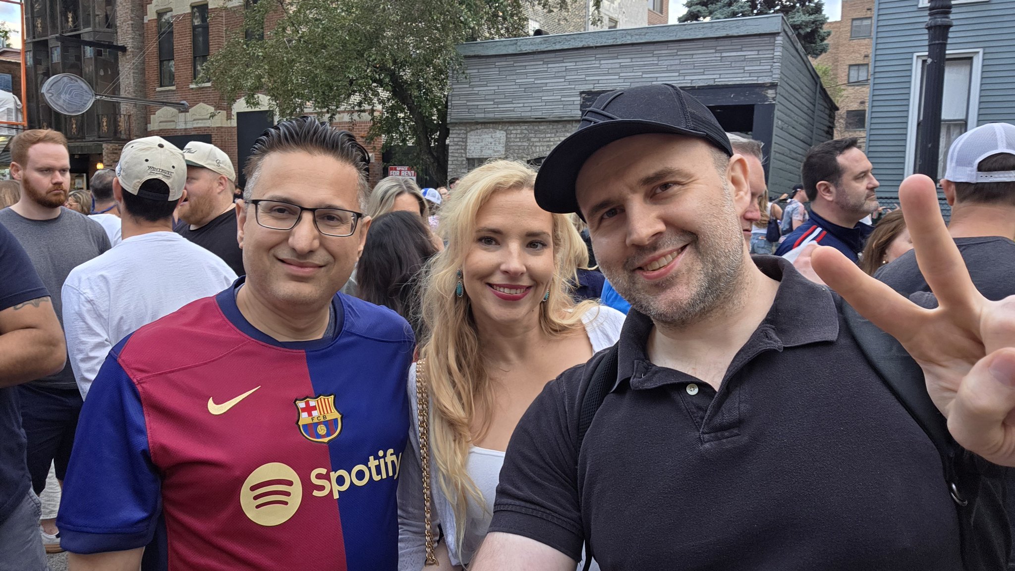 Adam taking a selfie with a festival-goer in a pink top at Wells Street