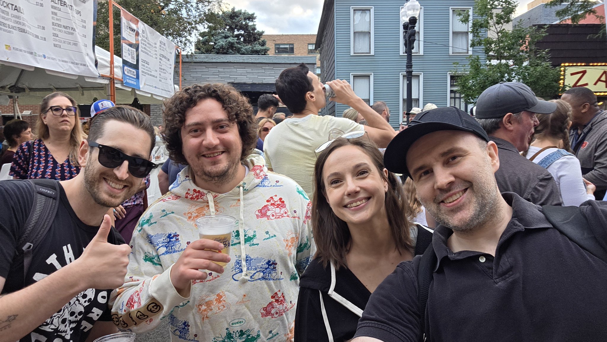 Adam taking a selfie with a festival-goer in a white shirt at Wells Street